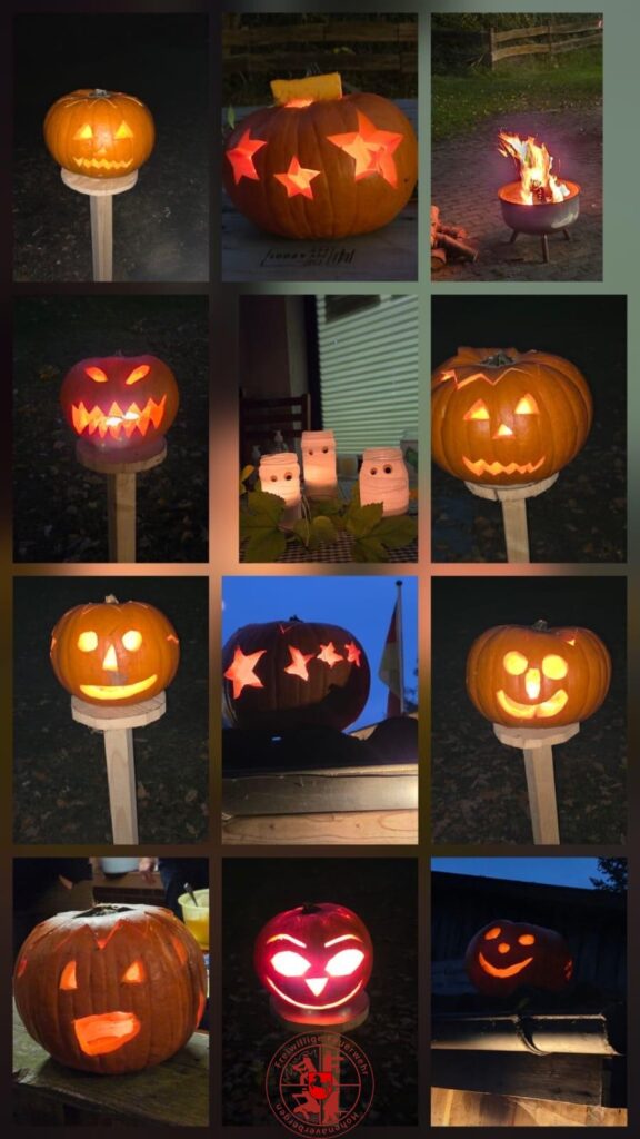 geschnitzte Kürbise die am Weg zum Schützenhaus den Weg erleuchten
